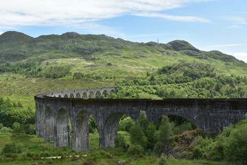Landscape of Glenfinnan Viaduct Viewpoint.The arch and curve of Viaduct. Train transportation.The famous view point form Harry potter in Scothland  UK