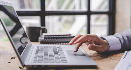 Typing on a tablet computer in a modern office. Make an account analysis report. real estate investment information financial and tax system concepts