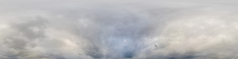 Sky panorama on overcast rainy day with low clouds in seamless spherical equirectangular format. Complete zenith for use in 3D graphics, game and for aerial drone 360 degree panorama as a sky dome