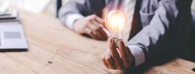 Think of the idea of ​​holding a light bulb. Innovative ideas that are inspirational and energy...