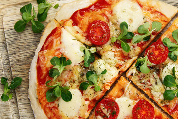 Margherita pizza on gray background.