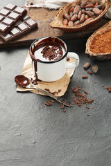 Melted chocolate drink on dark background.