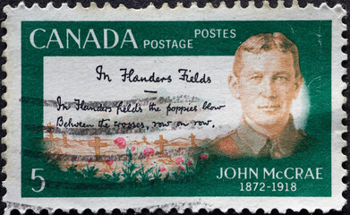 CANADA - CIRCA 1968: a postage stamp from CANADA, showing the portrait of the Canadian poet, writer and physician, John McCrae (1872-1918). Circa 1968.