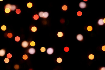 multicolored festive lights on a black background screensaver backdrop