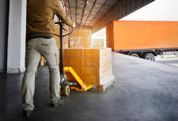 Workers Unloading Packaging Boxes on Pallets into The Cargo Container Trucks. Loading Dock. Shipping Warehouse. Delivery. Shipment Goods. Supply Chain. Warehouse Logistics Cargo Transport.	