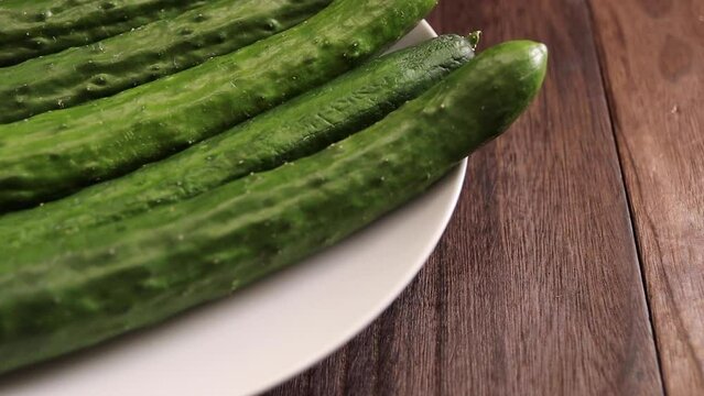 Vegetable cucumber spinning on the table