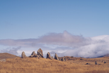 Megalithic standing stones and burial mound of Zorats Karer or Carahunge - prehistoric monument in...