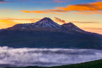 firts plane of Volcanoes Iztaccihuatl and Popocatepetl seen from top Mount Tlaloc in Mexico central valley