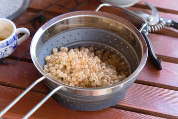 fresh, golden currants in a bowl