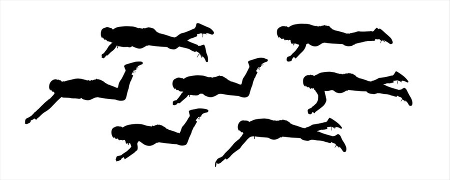 The guy lies in a horizontal position, his arms, and legs in different poses. The man lies on his stomach, trying to get something with his hand. Set of seven black male silhouettes isolated on white