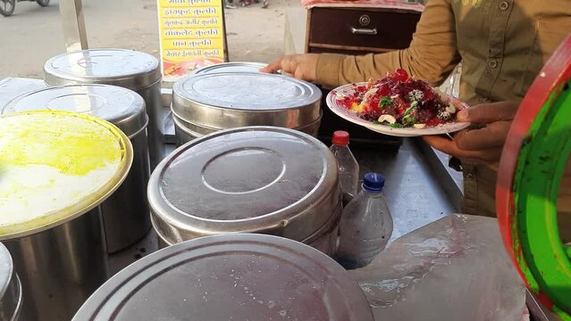 The Video Of Making Dry fruit Mava Ice Gola At street Road In India