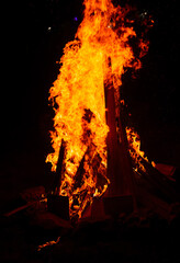 Warm camp fire and sparks during a party in the night