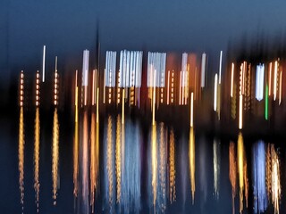 colourful harbor lights with ripples from water reflection pattern and design