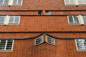 Amsterdam, Netherlands. June 2022. View of the facades of the characteristic brick building of residential complex with Amsterdam School style architecture
