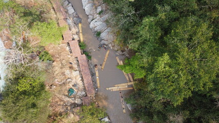 top view from drone Bamboo rafting in a river with green mountain nature at Mae Wang Chiang Mai Thailand. Aerial view