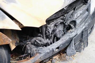 Fototapeta na wymiar Burnt out car and wiring faults closeup