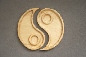 Portioned wooden yin yang dish on a gray background. Empty plate or tray, top view. combination plate