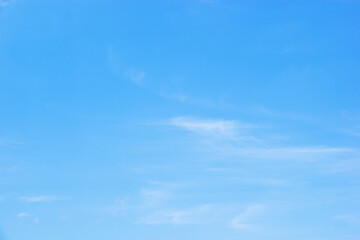 Blue sky background and white clouds soft focus, and copy space horizontal shape.