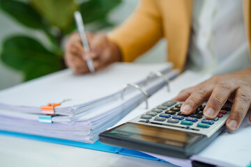 Businessman working and prepare paperwork report data to analysis information in file binder at office.