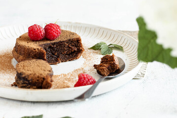 Brownie dessert in the plate on the light background