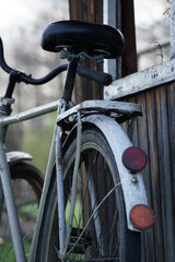 old bicycle in front of a house