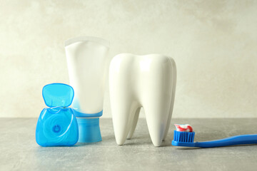 Concept of dental care or tooth care on gray textured table