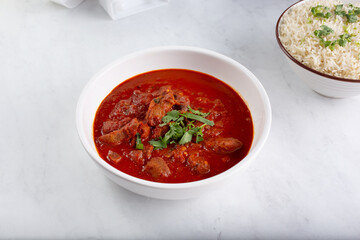 A view of a bowl of lamb vindaloo.