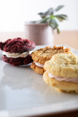A closeup view of a plate of sandwich cookies.