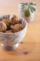 A view of a bowl of date energy balls.