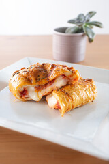 A view of a savory pizza pocket appetizer.
