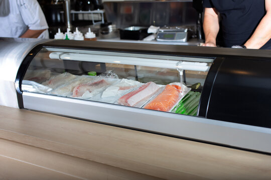 A view of a refrigerated sushi display case, seen at a local Japanese restaurant.