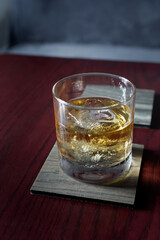 A view of a whiskey on the rocks cocktail.