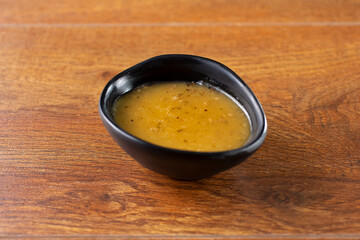 A view of a condiment cup of salad dressing.