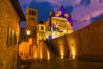View of Basilica of Saint Francis of Assisi at sunset during christmas time in Umbria Italy