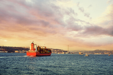 Big commercial cargo ship full of containers at Busphorus Turkey.