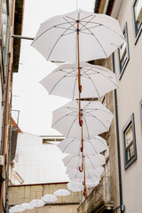 Fototapeta na wymiar umbrellas decorating a street in the center of Braga, Portugal.