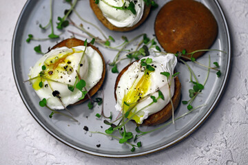 Poached eggs with microgreens.