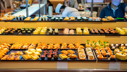 Sushi bar at restaurant. Sushi buffet, Japanese food that is loved by many nationalities and is healthy. 
