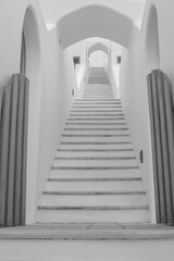 Whitewashed steps of a villa leading upstairs in Imerovigli Santorini in black and white
