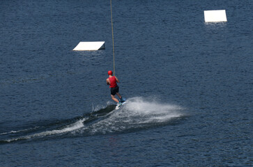 Boy water-skiing on a lake in Niedersfeld, Germany