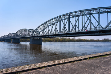 The Vistula River and the steel structure of the road bridge in the city of Torun