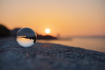 glass optical ball at sunset in the city in Ukraine