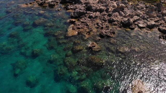 Aerial view of the beautiful green sea water of the Mediterranean Sea in the bay of Antony on the island of Rhodes in Greece