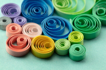 Paper quilling, or quilled paper. Spectrum of coiled paper strips in many colors. Background or...