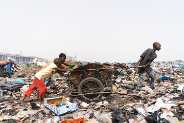 People at a landfill site in West Africa recycling household and industrial waste