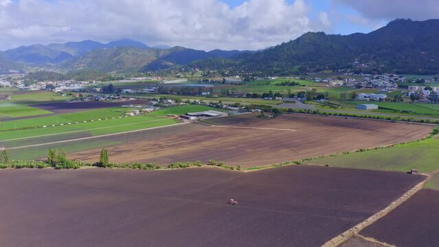 Drone flyover above cultivated fields in Constanza landscape, Dominican Republic