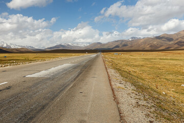 asphalt road, Bishkek Osh highway in Suusamyr valley of Kyrgyzstan.