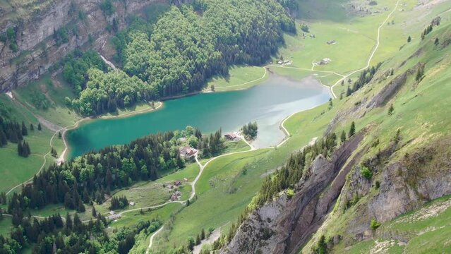 Drone shot of Seealpsee lake in the Alpstein range, Appenzell Alps, Switzerland