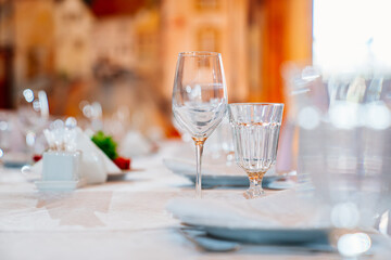 empty glasses on the served festive table. etiquette and serving lessons. restaurant and catering services.
