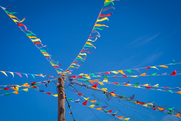 multi-colored festive flags at the fair flutter in the wind